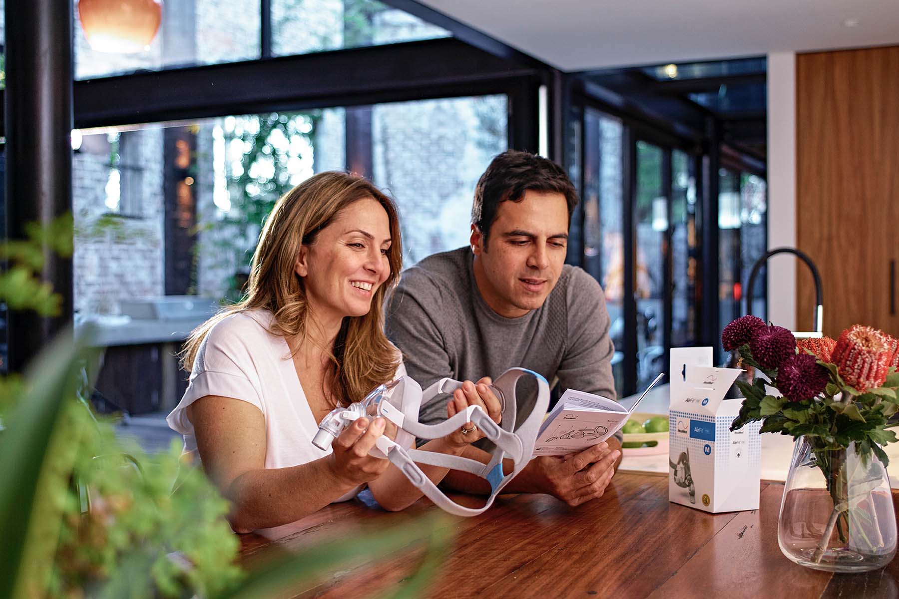 Couple looking at ResMed CPAP Mask Guide-3