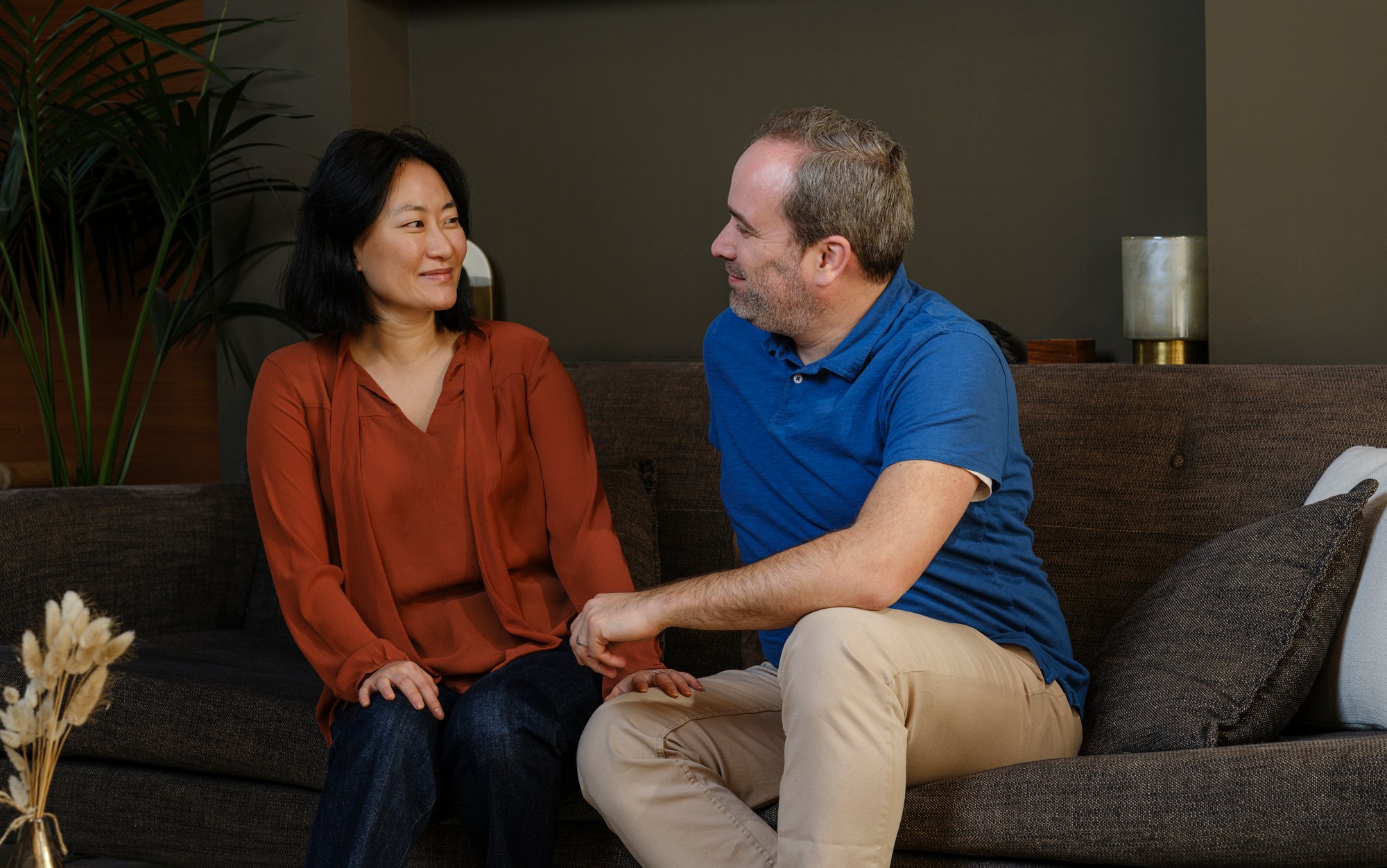 Man and woman sitting on the couch