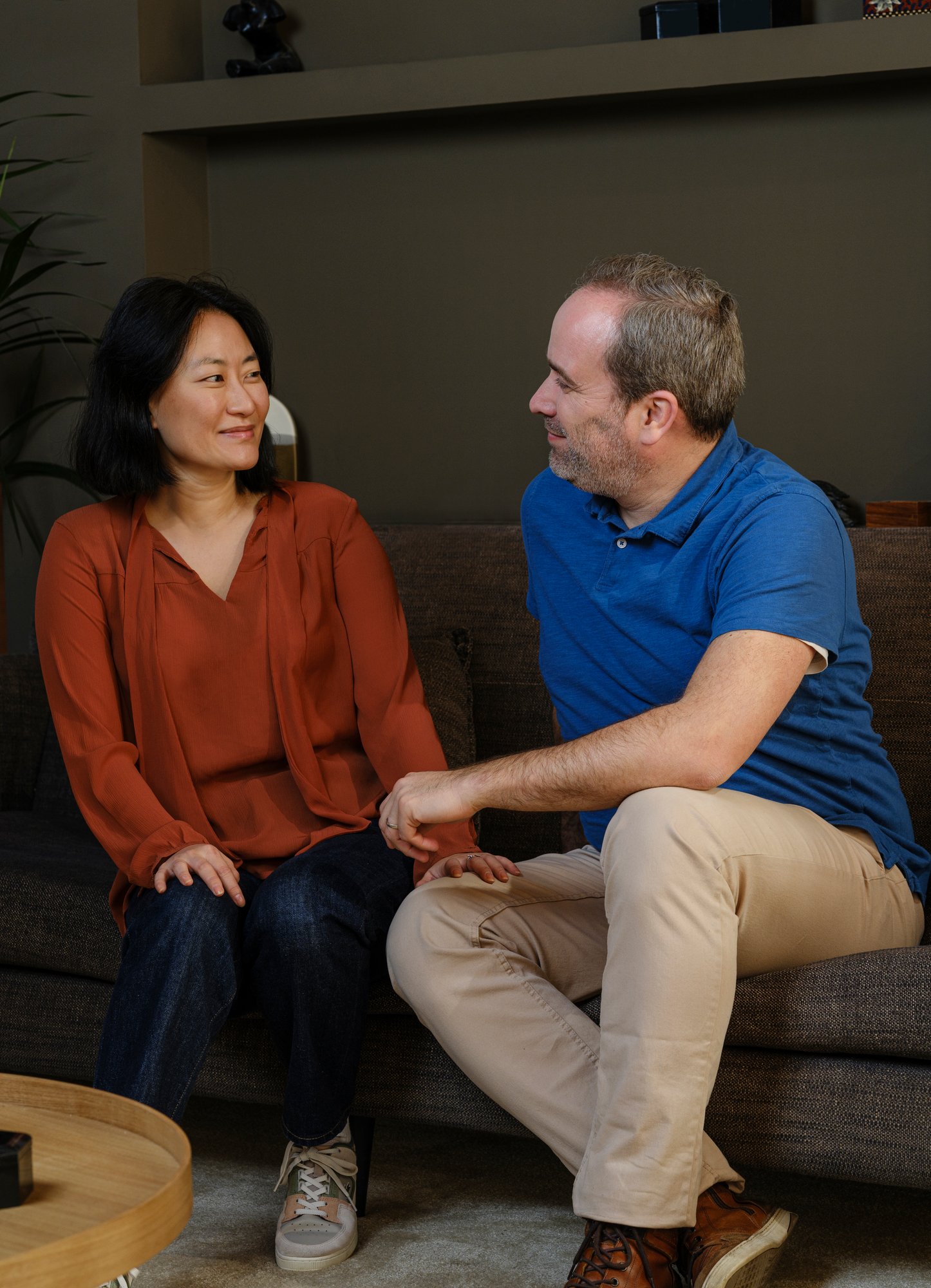 Man and woman sitting on the couch